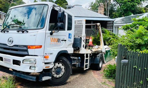 Delivering a skip bin to a home in Brisbane